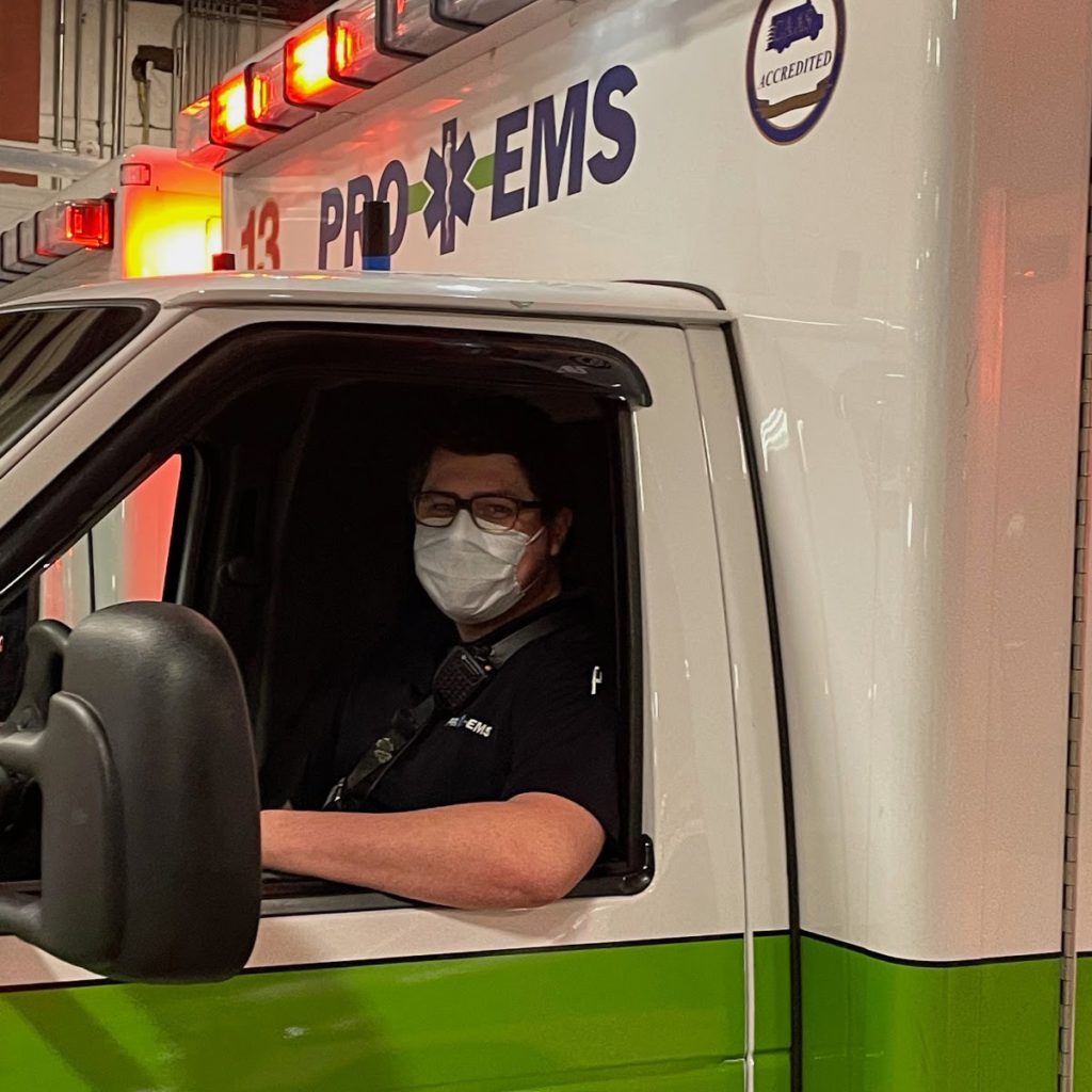 Pro EMS paramedic driving ambulance